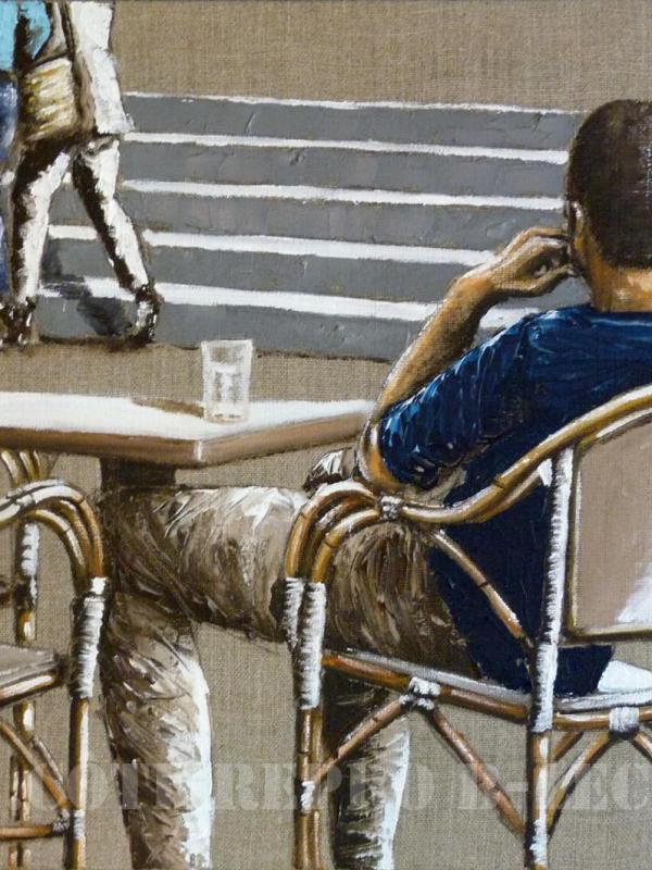 L'homme à la terrasse d'un café